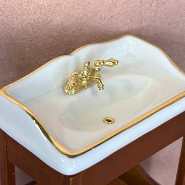 Håndvask m. guld armatur og guld deko